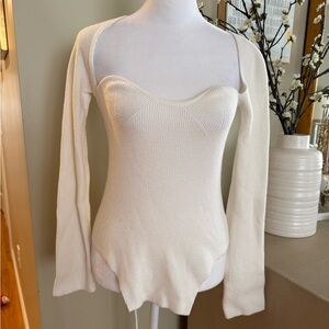 Knit jumper with split hem and unique neckline